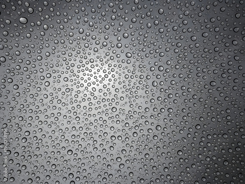 Close up of water droplets on transparent glass surface