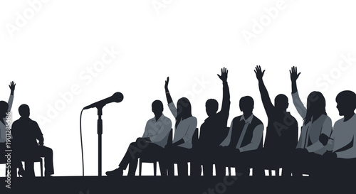 Silhouette of an engaged audience participating in a question and answer session next to a prominent microphone stand during a formal presentation or debate setting.
