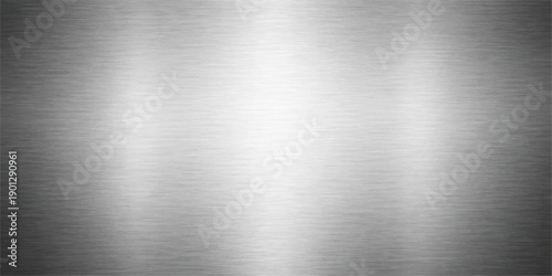 A polished stainless steel plate with a brushed metallic texture features a shiny silver industrial surface and gray aluminum pattern on a seamless titanium sheet backdrop