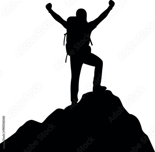 Silhouette of a man with arms raised on a mountaintop