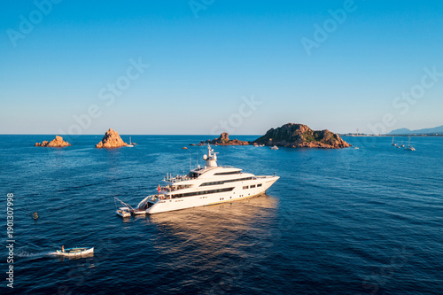 Εκτύπωση καμβά Luxury yacht sailing in the turquoise sea with Isola d'Ogliastra in the backgrou