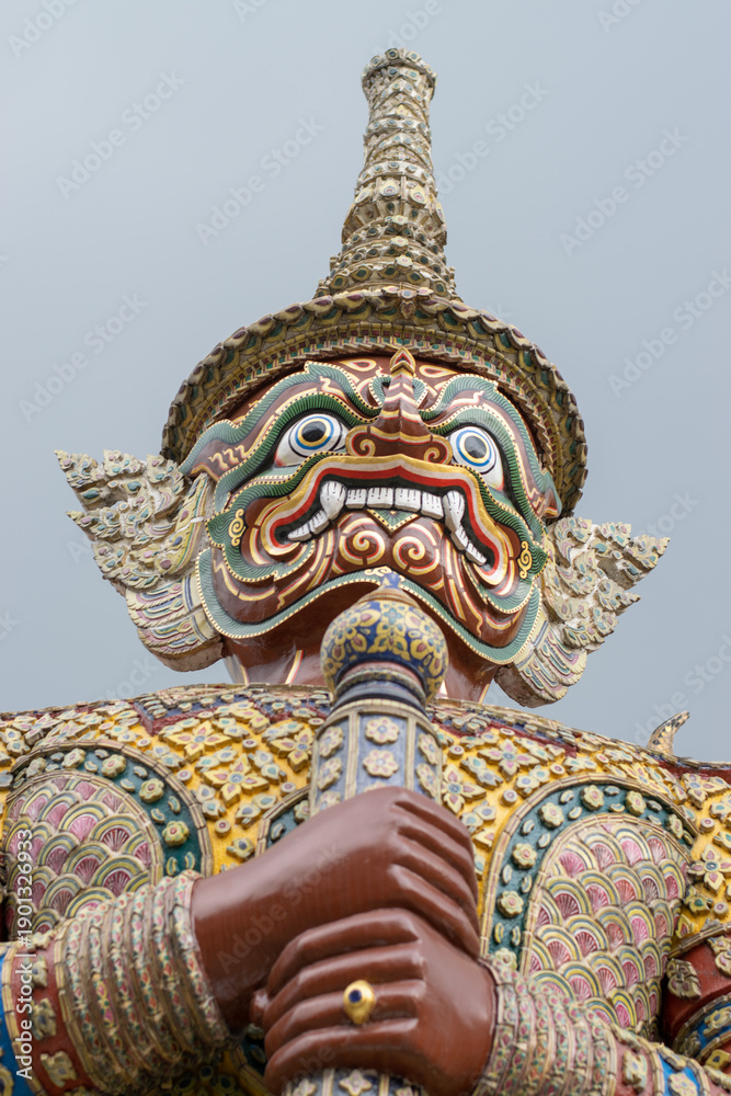 Fototapeta premium Majestic blue Yaksa guardian statue at the Grand Palace, Bangkok, Thailand.