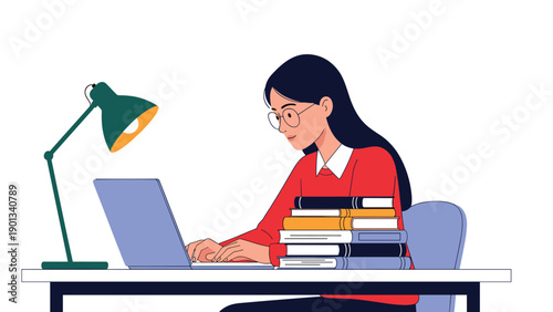 Person works at a tidy desk using a laptop beside a stack of colorful books under a green desk lamp while wearing glasses and a red sweater.