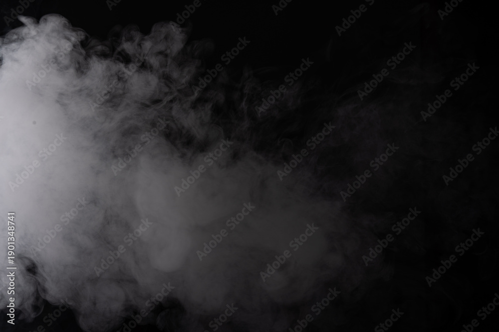 Fototapeta premium Thick white smoke across black background, billowing plume with soft diffusion, moody studio lighting, high contrast texture, ethereal