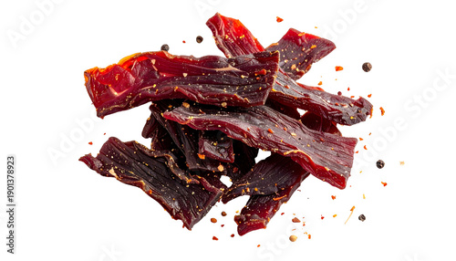 Close-up of seasoned, dried meat strips with visible texture on a transparent background