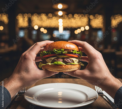 First-Person POV of a Hungry Man Holding a Gourmet Burger in a Cozy Restaurant