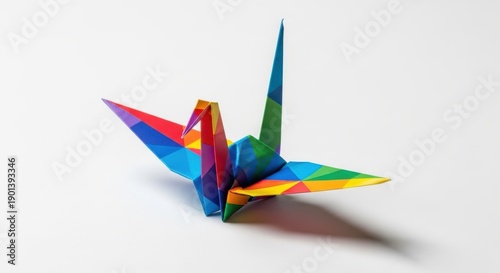 Colorful origami paper crane on white background, a symbol of peace and hope, detailed and vibrant