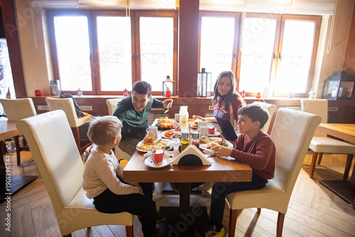 Family enjoying a cozy brea...