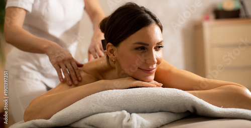 Woman receives a massage in...