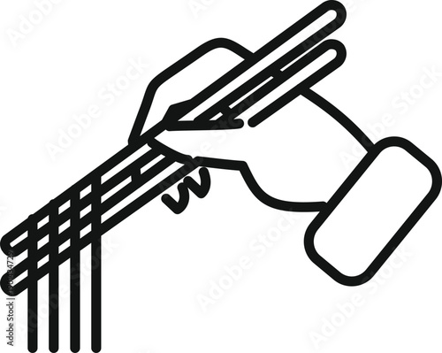 Hand holding two chopsticks picking up strands of noodles, an asian food utensil concept