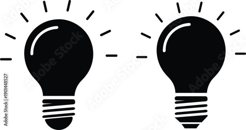 Two black light bulbs with rays of light on white background