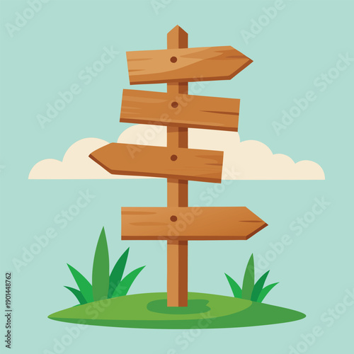 Wooden signpost with multiple blank directional signs on green grass