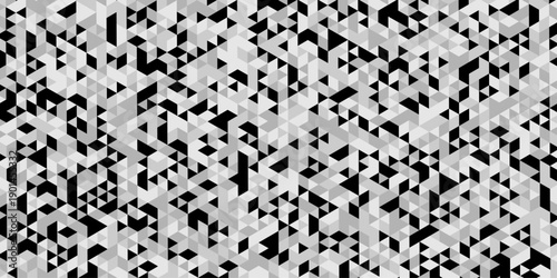 Triangle geometric pattern isolated on modern design, abstract image showcases a dense repeating pattern of small angled in varying shades of gray and black creating a textured effect.