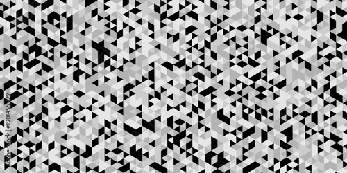 Triangle geometric pattern isolated on modern design, abstract image showcases a dense repeating pattern of small angled in varying shades of gray and black creating a textured effect.