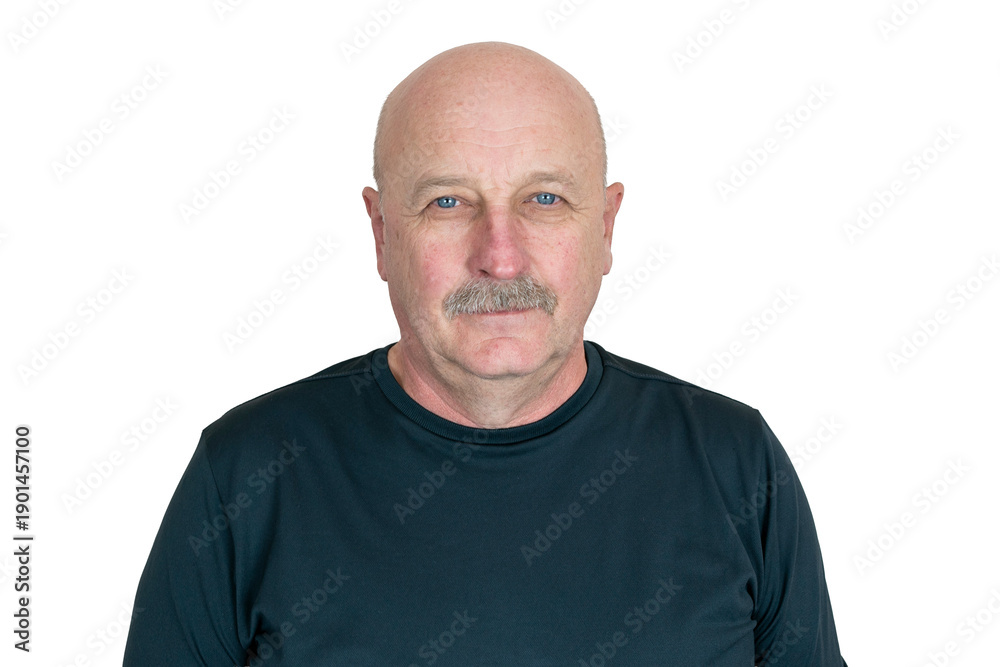 Obraz premium Man standing against a plain background wearing a dark shirt with short sleeves and a serious look on his face