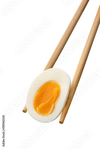 Soft boiled egg held with chopsticks isolated on white background