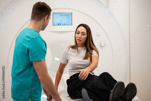 Принти на полотні Medical professional assisting patient preparing for mri scan