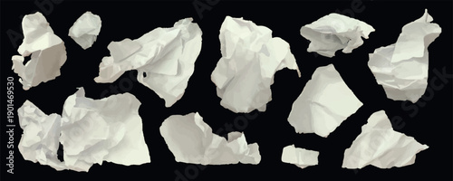 Set of torn and crumpled paper pieces on dark background