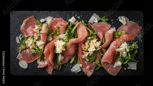 Wallpaper Mural Top view of a salad featuring Parma, prosciutto, arugula, and cheese on a black background Torontodigital.ca