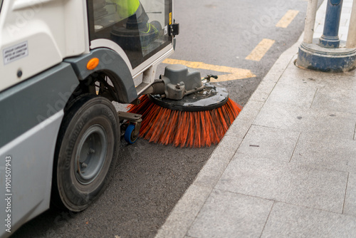 Canvastavla Street sweeper cleaning road with rotating brush in city