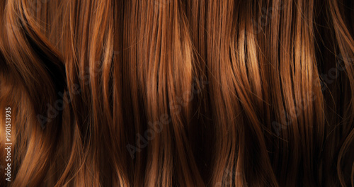 Close-up abstract texture of flowing brown hair forming elegant natural waves and curves. Organic motion, soft light and rich tones create a cinematic beauty background or luxury visual element.