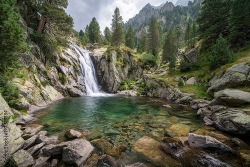 Serene mountain waterfall cascading into a crystal-clear turquoise pool surrounded by lush pine trees and rugged rocks under a cloudy sky in a peaceful alpine landsc