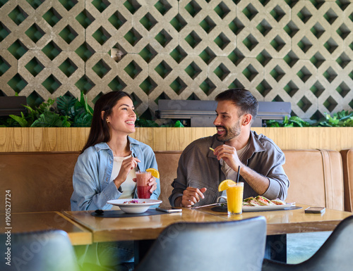 Wallpaper Mural Portrait of ayoung romantic couple in restaurant having lunch Torontodigital.ca