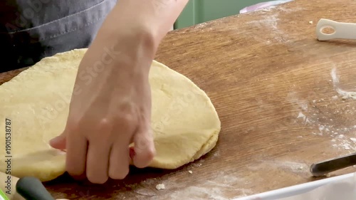 Hands Rolling Fresh Dough for Traditional Italian Fried Focaccia