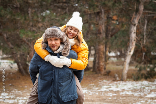 Happy young couple in park ...
