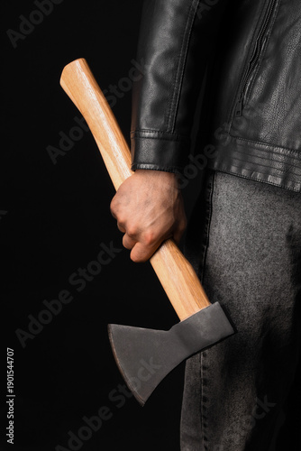 Man with ax on black backgr...