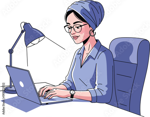 Stylish woman in a blue turban and glasses working intently on a laptop at her desk.