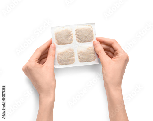 Woman holding mustard plast...