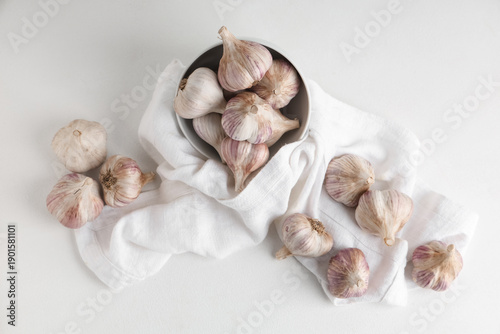 Wallpaper Mural Bowl with fresh garlic on white background Torontodigital.ca