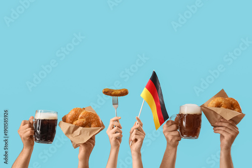 Many hands with mugs of col...