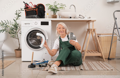 Mature female plumber with ...