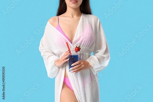 Young Asian woman with glas...