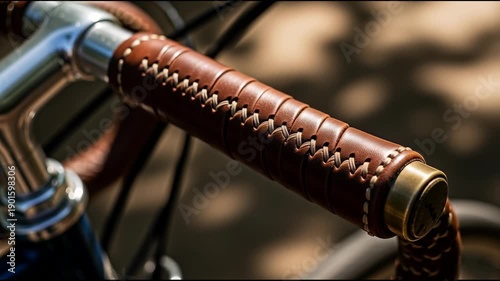 Close up of a bicycle handlebar with brown leather grip