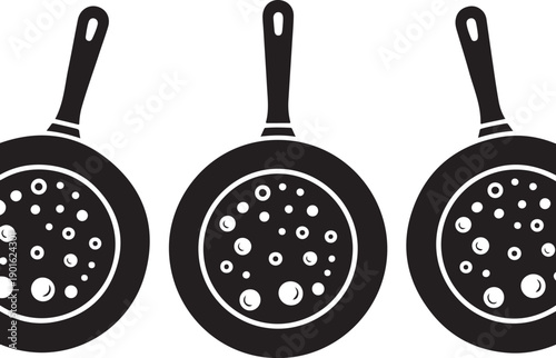 Three kitchen frying pans with bubble texture, black and white cooking utensils