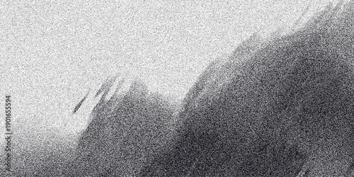 Abstract monochrome grainy texture resembling a stormy sky with blurred mountainous landscape in grayscale tones and dynamic light streaks creating a dramatic atmospheric effect