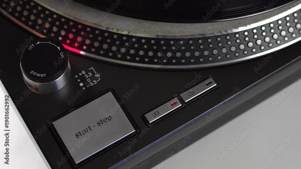 Turntable Stop Man switch on turntable, put record and push start then push stop ...