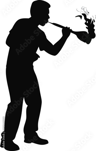 Silhouette Of A Man Blowing Glass