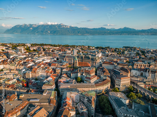 Fotografie Aerial view of Lausanne city with historic buildings, urban skyline, and Lake Geneva in the background