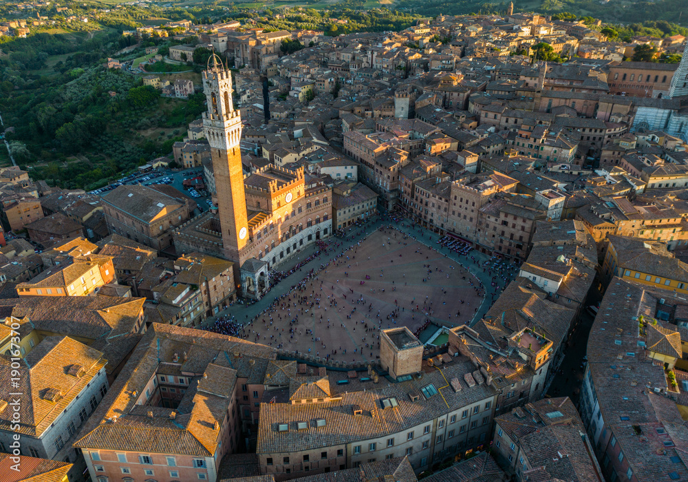 Fototapeta premium Aerial view of Piazza del Campo, the historic main square of Siena, featuring Torre del Mangia and medieval architecture in Tuscany, Italy