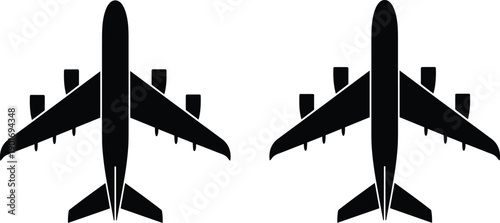 Two identical black silhouette jet airplanes viewed from directly above isolated on a white background