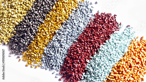 Colorful polymer plastic masterbatch pellets arranged by shade, showcasing high-quality additives used to enhance color, stability, and performance in plastic manufacturing processes efficiently