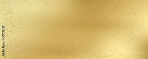 Gold wall texture background. Yellow shiny gold foil paint on wall sheet with gloss light reflection, vibrant golden paper luxury wallpaper