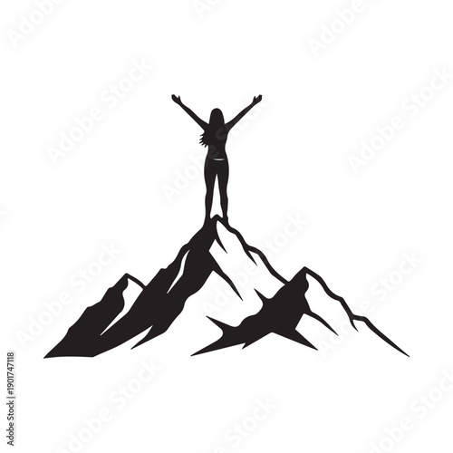 Person standing on top of a mountain with arms raised