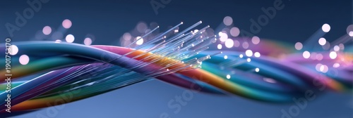 Close-up of colorful twisted fiber-optic cables with exposed glass strands emitting light against a soft bokeh background, symbolizing high-speed data and connectivity.