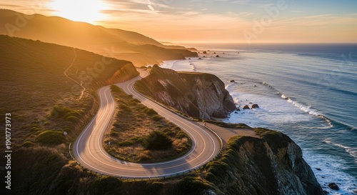 A beautiful sunset and sunrise glow over the sea and river landscape where the sun meets the horizon across the beach, mountains, and calm water under a cloudy sky