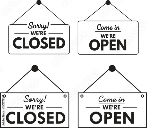Business signs indicating open and closed hours